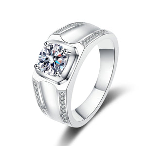 Silver ring with a large central gemstone and smaller stones on a white background