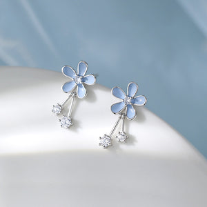 Boucles d'oreilles pendantes en forme de fleur en émail bleu