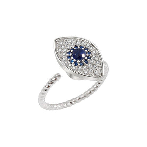A silver ring with a large blue and clear cubic zirconia evil eye-shaped inset, designed as a fidget spinner.