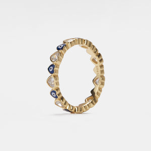 Gold ring with heart-shaped evil eye and gemstones on a white background