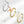Three butterfly-shaped rings in silver, gold, and multicolor on a white background