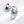 Silver ring with blue butterfly design and gemstones on a white background