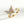 Gold spinner ring with diamond-encrusted butterfly design on a white background