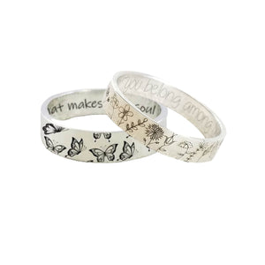 Two patterned rings on a white background
