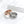 Two rings, one rose gold and one silver, with cat face designs on a white background.