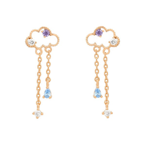 Gold drop earrings featuring cloud-shaped stud tops with purple and clear stones, accented with double chain dangles and blue teardrop gemstones, set against a white background.