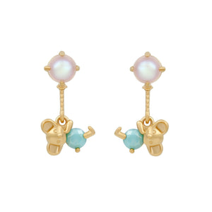 Gold drop earrings featuring round pearl studs with dangling koala-shaped charms and turquoise beads, set against a white background.