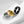 Three rings in gold, silver, and black on a light gray background
