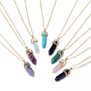 A collection of crystal raw stone healing necklaces with pendants in various colors, displayed on a white background.