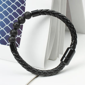 A multicolor beaded leather rope bracelet with gold plating on a textured background.