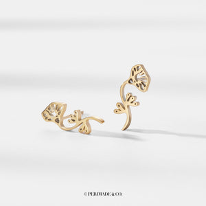 Gold earrings on a white background with 'PERIMADE & CO.' branding.