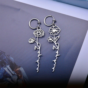 A pair of gold-plated stainless steel drop earrings designed as a rose and flower arrangement, displayed against a white background.