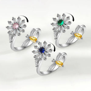 Three silver rings with colorful gemstones on a white background