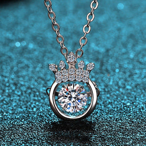 Silver necklace with a round diamond pendant on a textured blue background