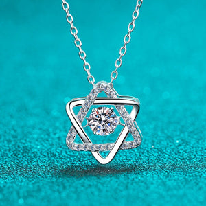 Silver necklace with a diamond pendant on a turquoise background