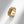 Gold evil eye spinner band ring on a white surface
