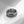 Silver evil eye spinner band ring on a white surface