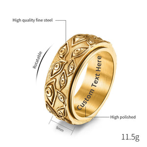 Gold evil eye spinner band ring on a white backgound