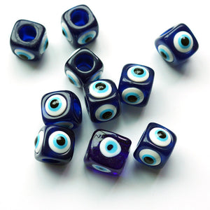 Blue beads with eye design on a white background