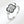 A silver ring with a four leaf clover design and a small cubic zirconia stone on the band.