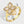 A gold-colored fidget spinner ring with a four leaf clover design, featuring clear cubic zirconia stones.