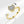 Gold open ring with a heart-shaped diamond on a white background