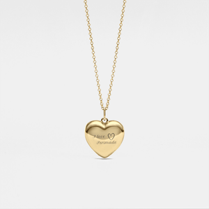 Gold heart-shaped locket necklace on a light gray background
