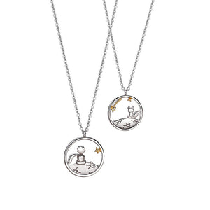Two silver necklaces with the little prince and fox pendants on a white background