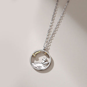 Silver necklace with the fox pendant on a light background