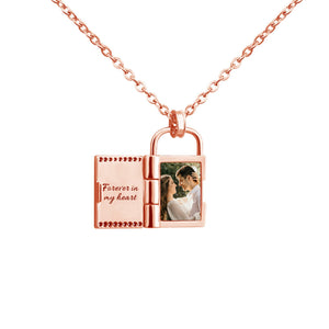 Rose gold openable photo lock pendant on a chain on a white background