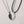 Two necklaces with geometric pendants on a light gray background