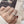 Silver ring on a finger with a blurred background