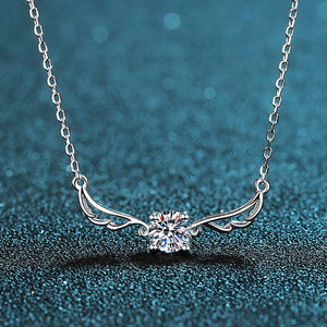 Silver necklace with a diamond on a blue textured background