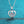 Silver heart-shaped necklace with a diamond on a blue background