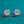 Pair of diamond stud earrings on a teal background