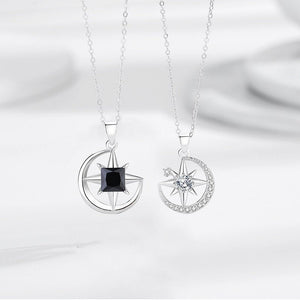 Two silver pendants with gemstones on a white background