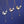 Three butterfly-themed necklaces on a blue background