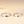Two silver rings with mountain and wave designs on a beige background