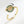 Gold spinner ring with saturn charm on a white background