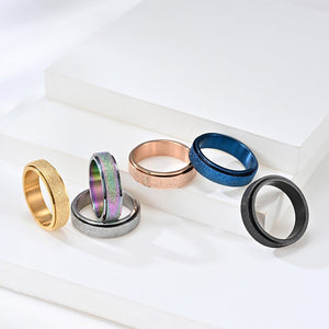 Set of six colorful rings on a white surface
