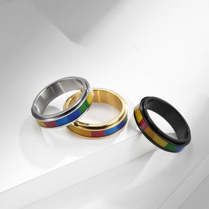 Three rings with rainbow stripes on a white background