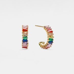Multicolored gemstone hoop earrings on a light gray background