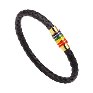A series of leather bracelets with gold plating and rainbow-colored accents on a white background, representing the LGBTQ pride colors.