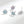 Set of sea turtle-shaped earrings with gemstones on a white background