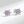 A pair of small purple sea turtle stud earrings made of sterling silver with hypoallergenic finish.