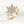 Gold ring with diamond bouquet design on a light gray background