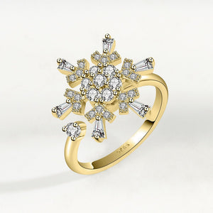 Gold ring with diamond bouquet design on a light gray background