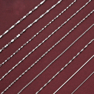 Silver chain on a maroon background