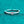 Silver ring with a heart-shaped diamond on a teal background
