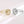Gold and silver spinner rings with star designs on a light background
